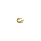 Gold ring with a small white stone on a white background