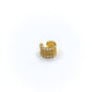 Gold ring with multiple bands on a white background