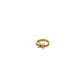 Gold ring with a white stone on a white background