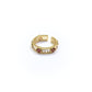 Gold ring with gemstones on a white background