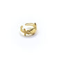 Gold ring with shell design on a white background