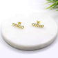 Gold Filled Flat Earrings on display, elegant and sophisticated stud accessories.