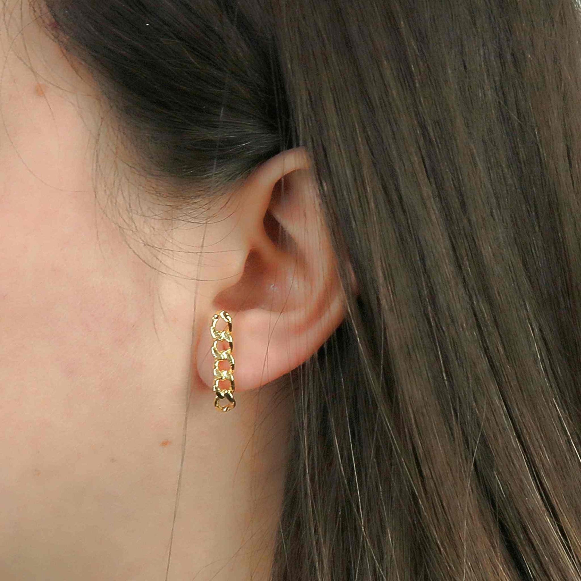 Gold filled flat earring on ear, luxury statement stud.