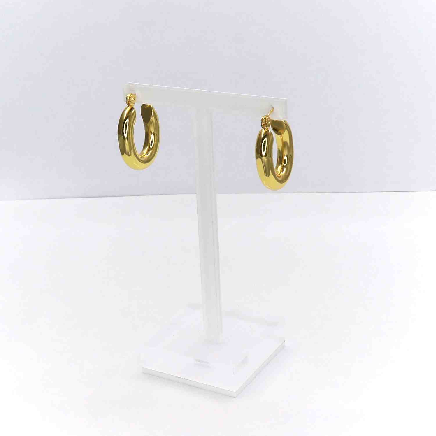 Gold oval earrings on display stand, crafted from high-grade stainless steel.