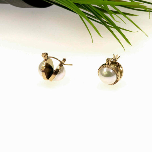 Pearl earrings with stainless steel in gold setting, elegant and durable.