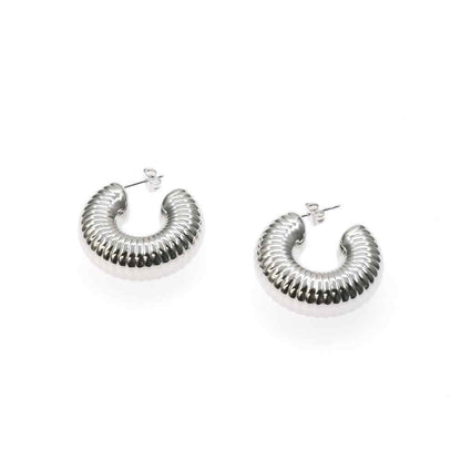 Chunky silver and gold AFRICA II HOOP earrings with a bold, statement design.