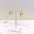 Gold rope earrings on display stand, made from high-quality stainless steel.
