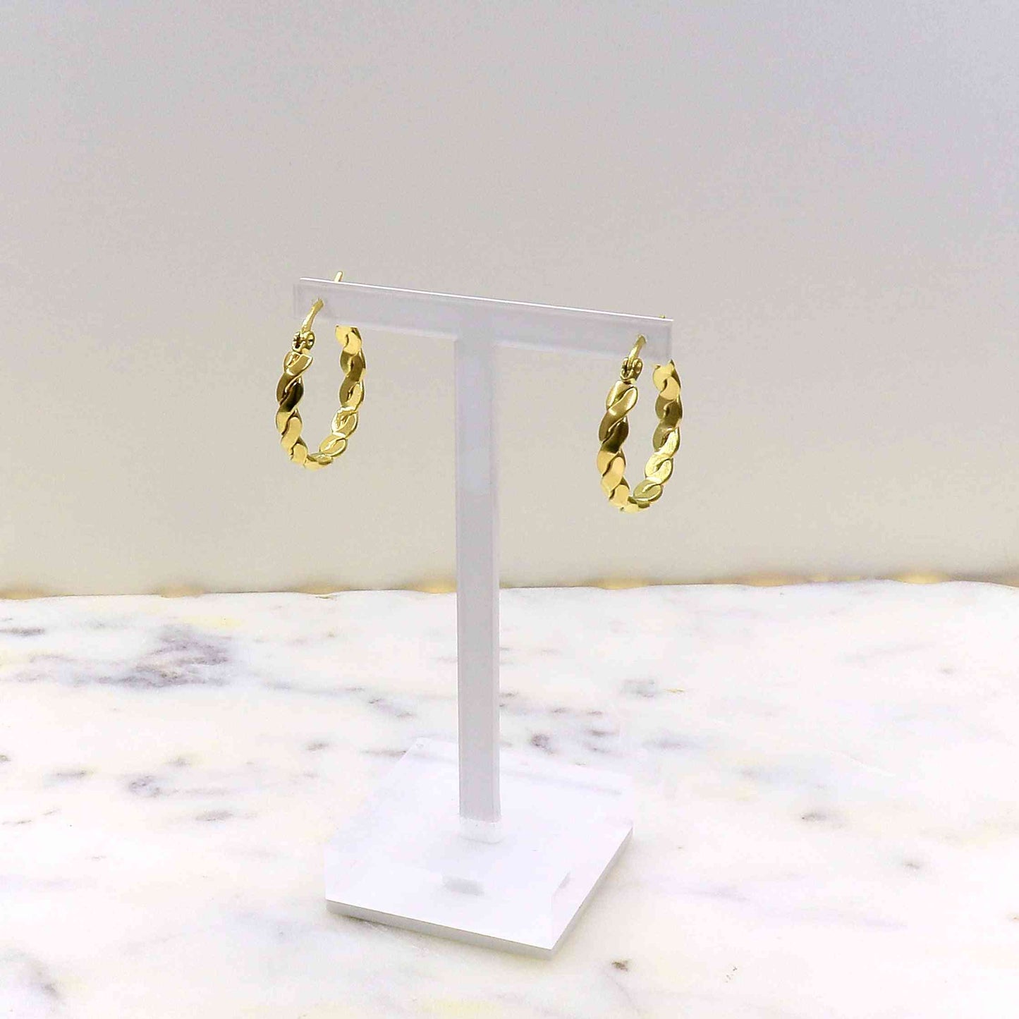 Gold rope earrings on display stand, made from high-quality stainless steel.