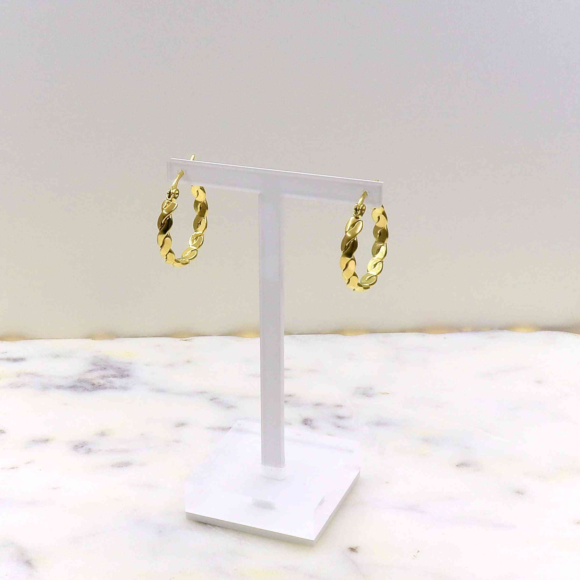 Gold rope earrings on display stand, made from high-quality stainless steel.