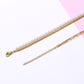 Elegant gold pearls layering chain necklace with lobster clasp on white and pink background