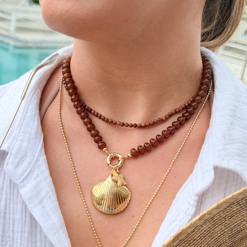 Gold Shell Pendant with Dangling Starfish