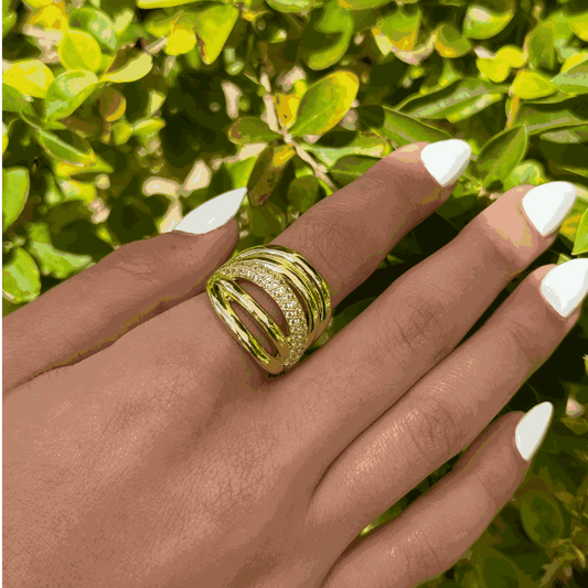 Fashion gold ring with sparkling crystals on hand, adjustable sizing.