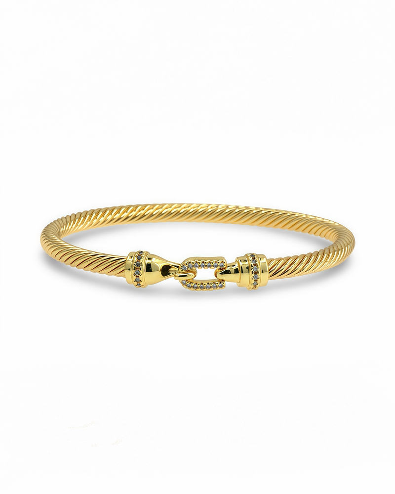Gold cable bangle bracelet with pavé clasp