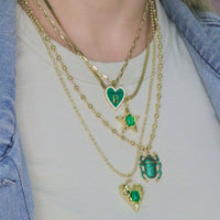 14k Gold Plated Mother Of Pearl Heart Pendant With Gemstone Center