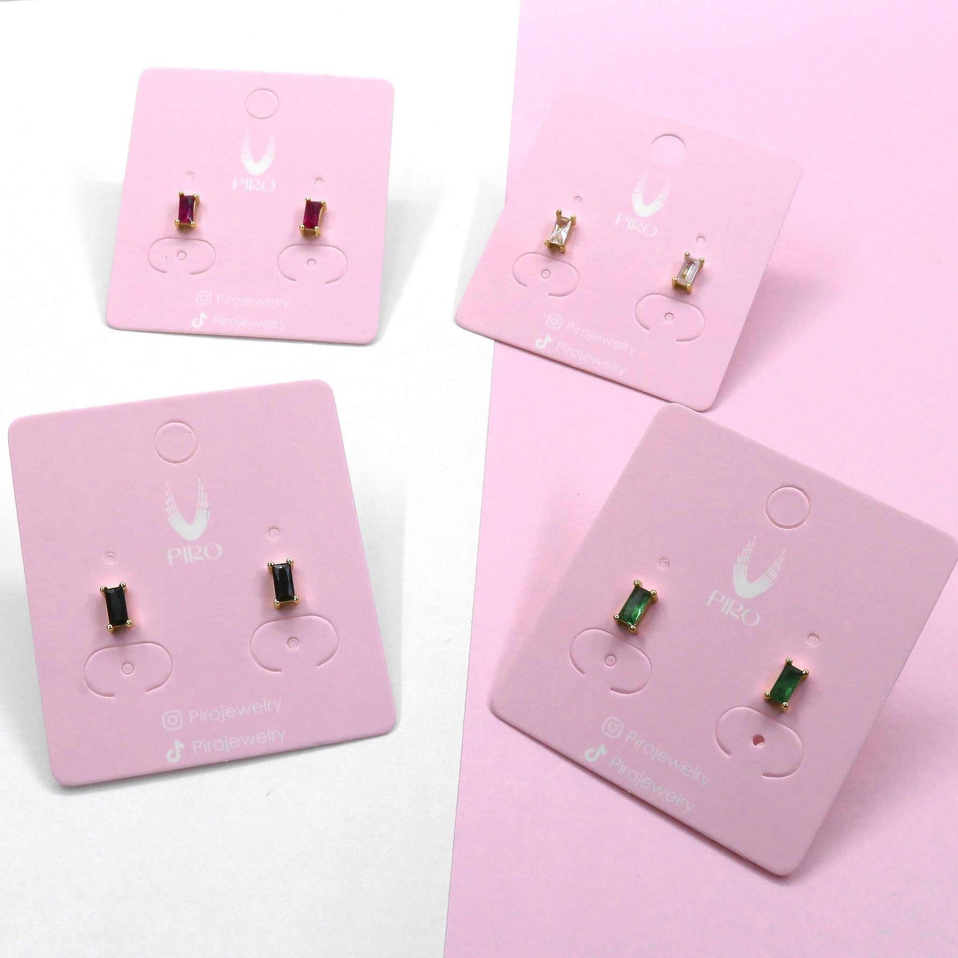 Mini square stud earrings in assorted colors on display cards.