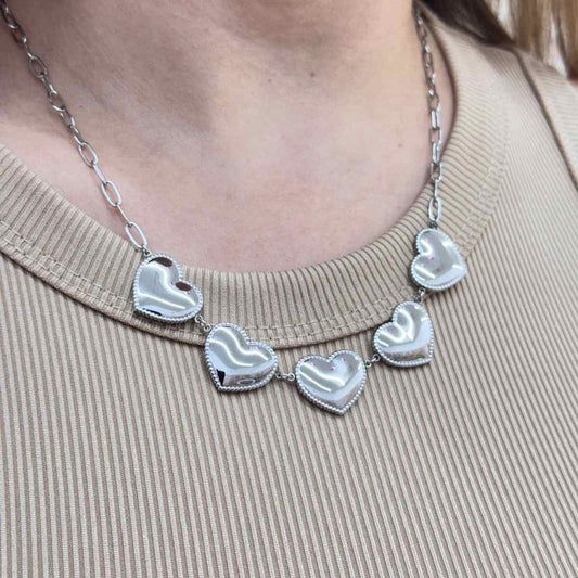 LOVE CHAIN with solid heart charms on a stainless steel golden and silver chain.