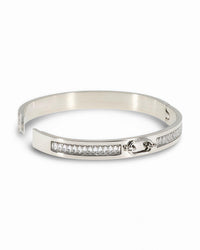RIGID BANGLE BRACELET WITH OVAL CENTER BUCKLE DESIGN AND PAVE ZIRCONIAS