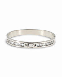 RIGID BANGLE BRACELET WITH OVAL CENTER BUCKLE DESIGN AND PAVE ZIRCONIAS