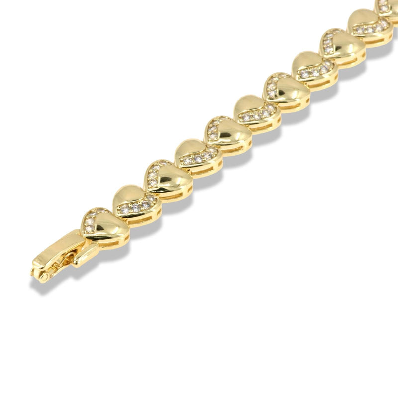 Gold heart bracelet with continuous zirconia wave