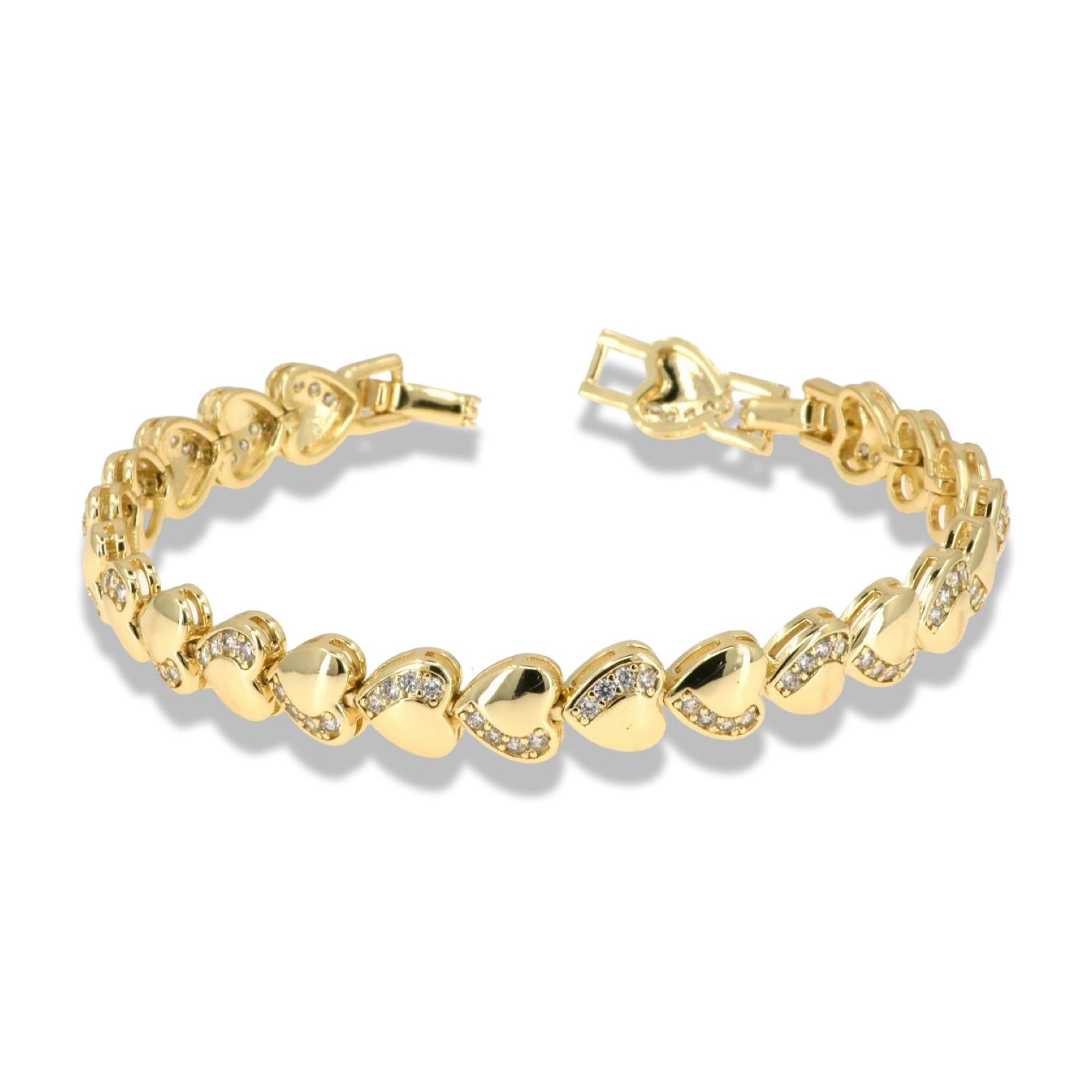 Gold heart bracelet with continuous zirconia wave