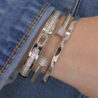 RIGID BANGLE BRACELET WITH OVAL CENTER BUCKLE DESIGN AND PAVE ZIRCONIAS